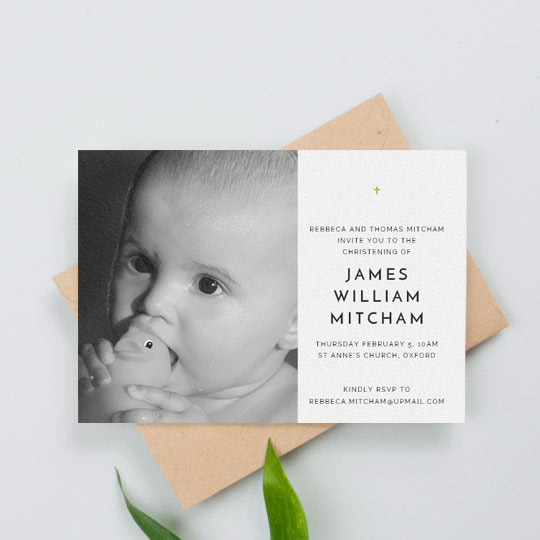 Christening Invitation Card - "Baby Cross" A simple christening invitation with a baby photo on the right-hand side. There is a black and white photo on the left of the christening invitation. The right-hand side has a small, gold crucifix.