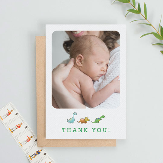 Baby Thank You Card - "BabySaurus" A portrait baby thank you card with dinosaurs underneath a baby photo. The photo on the thank you card takes up most of the design.