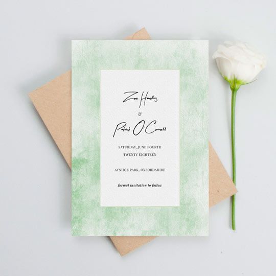 Wedding Save the Date Card (Rustic) - "Rustic Green (Save the Date)" A rustic wedding save the date card with a worn green background. The centre of the save the date is white with black text detailing the particulars of an upcoming wedding.