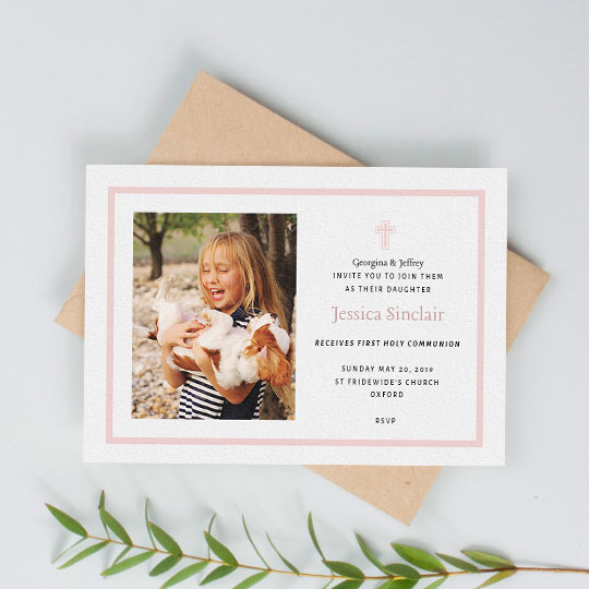 Holy Communion Invitation - "Baby Pink Cross" A first holy communion card for a young girl. The card has a simple, pink border and pink religious crucifix. Underneath the cross are details of an upcoming communion service.